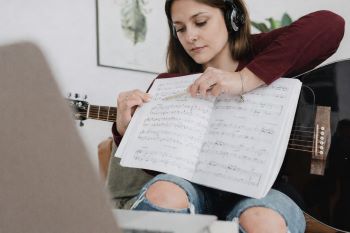 Student taking a music lesson online